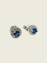 Topos en plata zircon circular azul con marco circones blancos